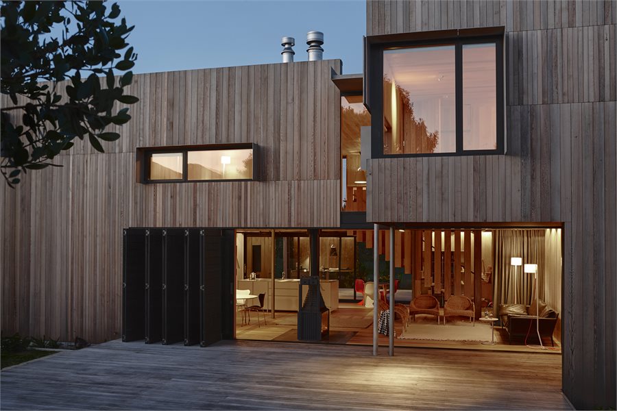 Large APL Architectural Series sliding doors create several entryways on all sides of this coastal home