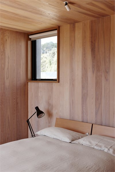Playfully positioned windows in the bedrooms punctuates the building's rectangular forms