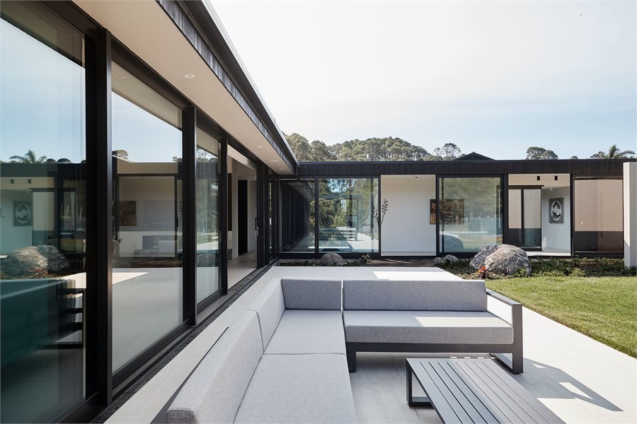 Expansive APL Architectural Series joinery becomes a feature of this home