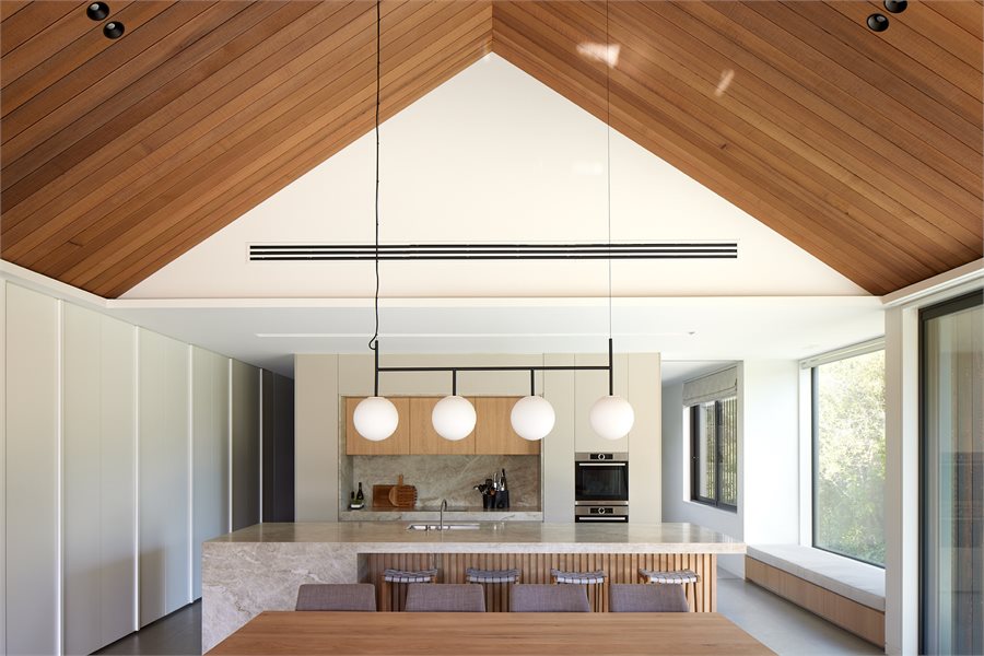 A window seat in the kitchen keeps the space inviting