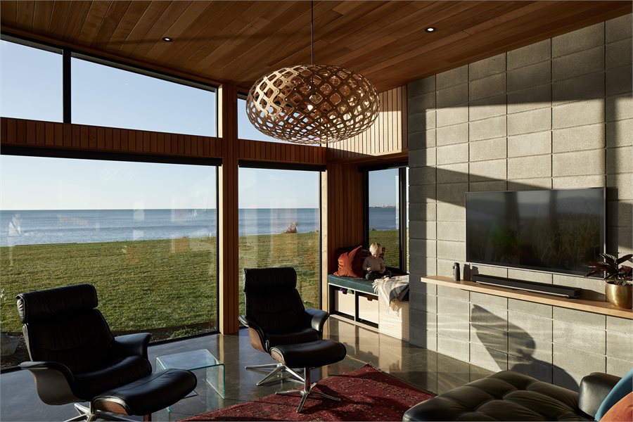 A reading nook was top of the wish list. A sliding window sits behind the built-in seat in this space, which also includes an Altair Louvre System by Breezeway from First that's safe to leave open even when the family isn't home.