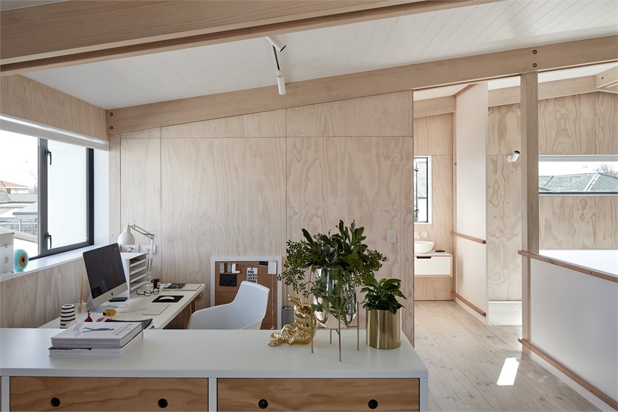 The vanities are tucked into the cavities either side of the bridge that connects the bedrooms/office, which would have been dead space. The windows above them have a reflective coating that allows them to function as mirrors.