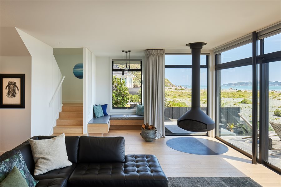 The living area opens up to the 180-degree viewframe of Mākaro Island