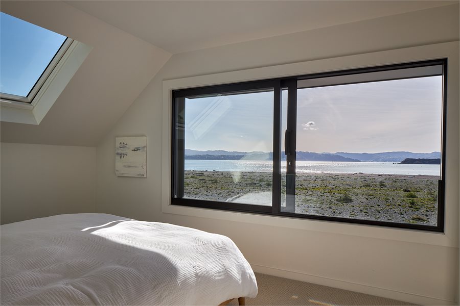 Sliding windows provide ventilation with a bedroom view