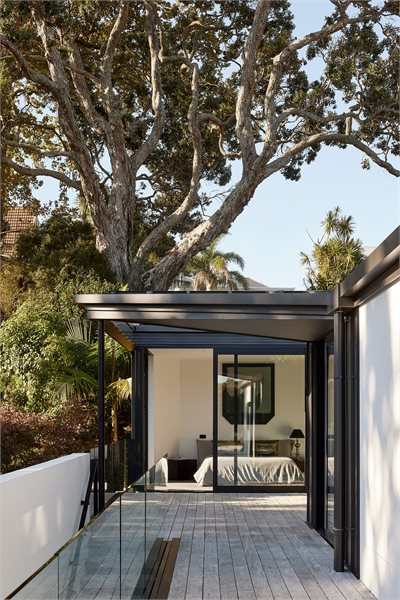Exterior looking into Master Bedroom with APL Architectural Series Sliding Doors