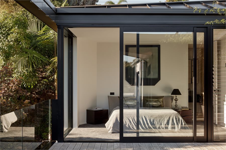 Master Bedroom with APL Architectural Series Sliding Doors with glass louvres