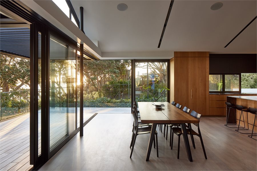 Modern Living/Dining Area with APL Architectural Series Sliding Doors
