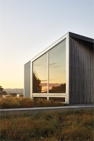Large raked windows are custom made to meet the angled roof