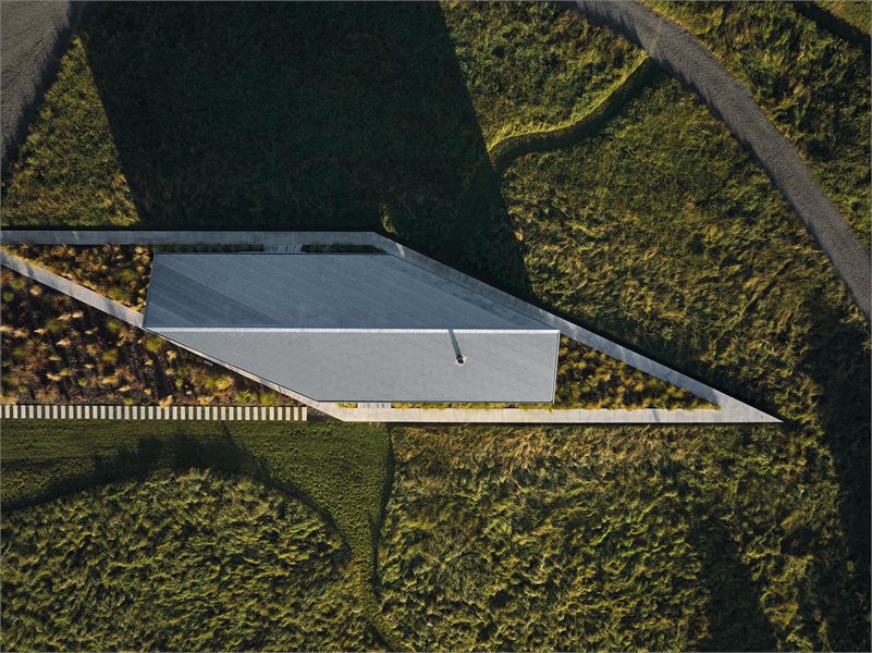 The home has a unique S-shaped footprint
